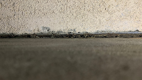 Peering under the stucco - nothing to see here IMHO